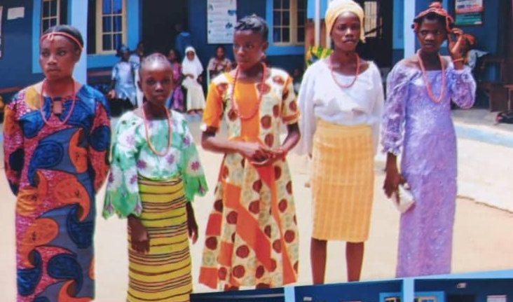 Pupils and staff in colourful Ankara and traditional fabrics